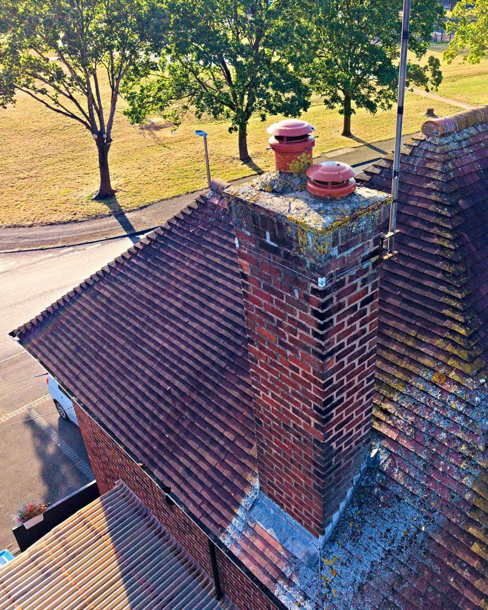 Home Close-up sub-250g drone inspection of a roof , brick chimney stack and lead flashing in Runcorn