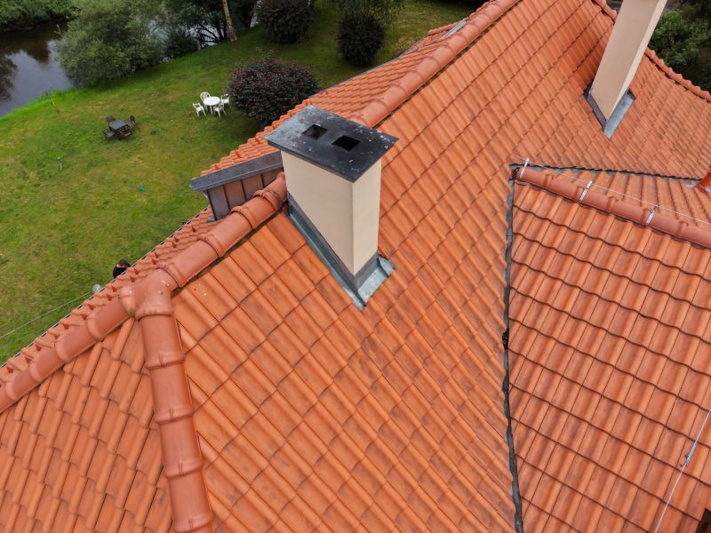 Home High-resolution drone roof survey showing detailed chimney flashing and tile condition in Widnes, Merseyside